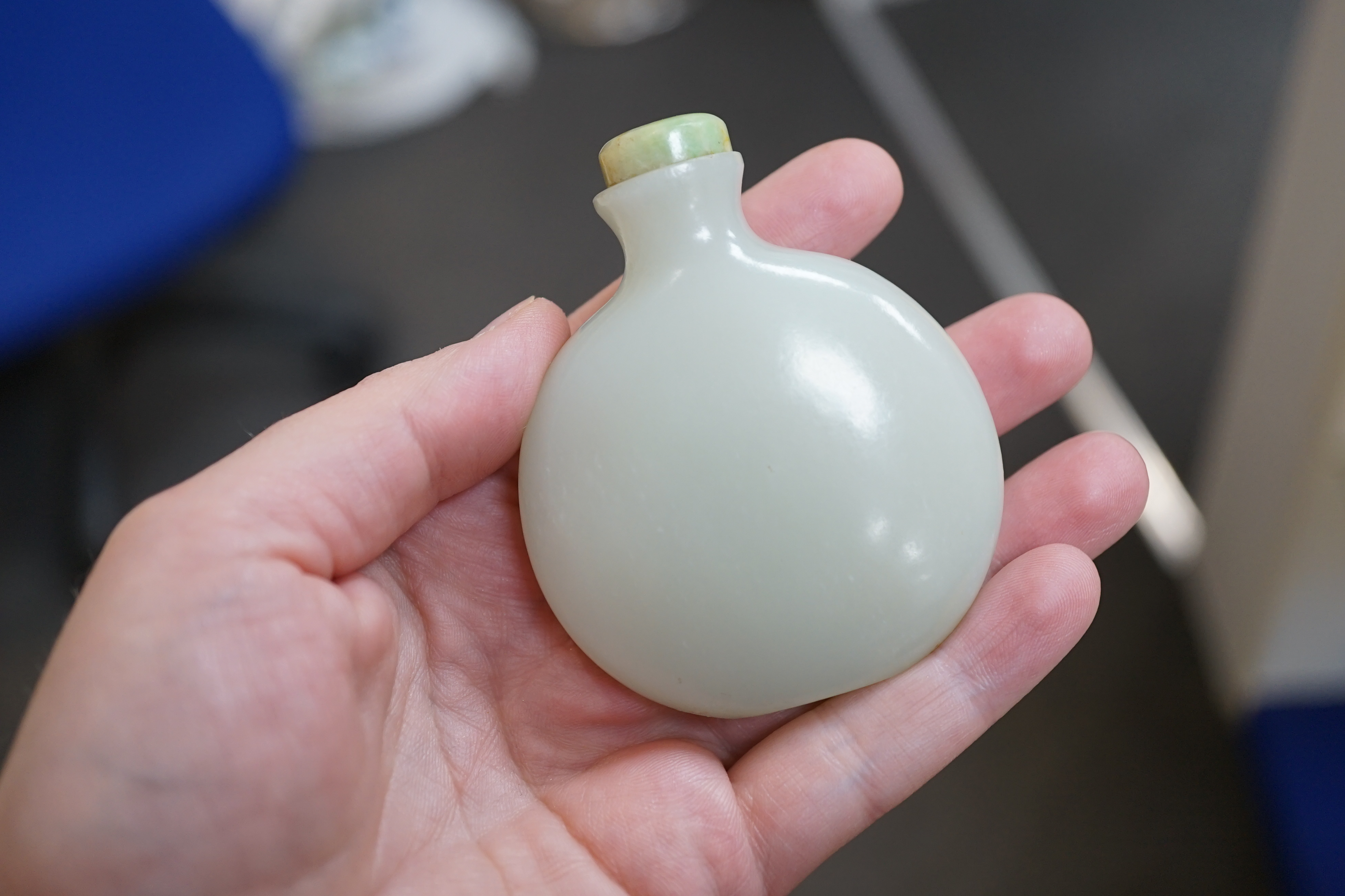 A Chinese pale celadon jade snuff bottle, of moonflask form, 19th century